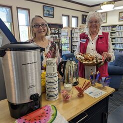 Two Friends serve coffee and baked goods during a coffee social