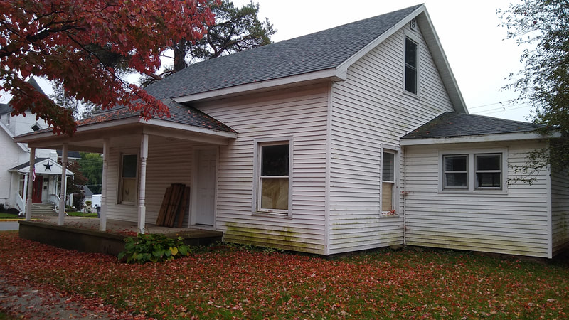 The home formerly on the property purchased by the library.