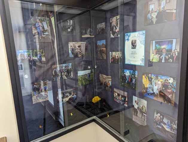 Display case featuring photos of Becky Brower