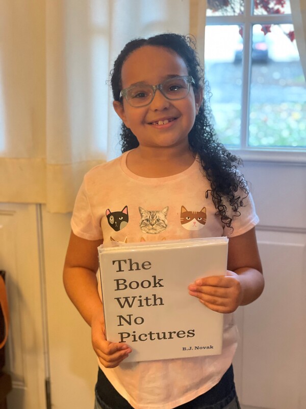 Megan's daughter Scarlett with "The Book With No Pictures"
